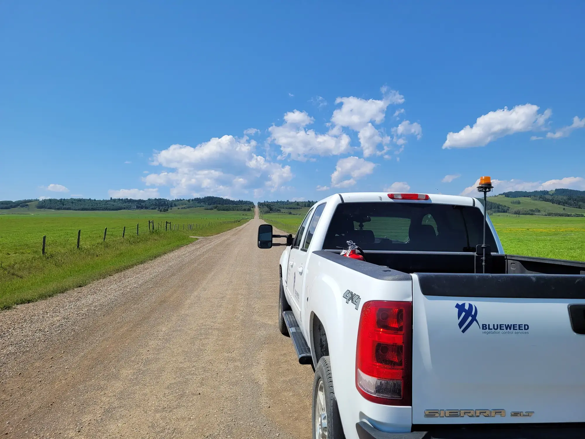 Blueweed truck on a rural Alberta road