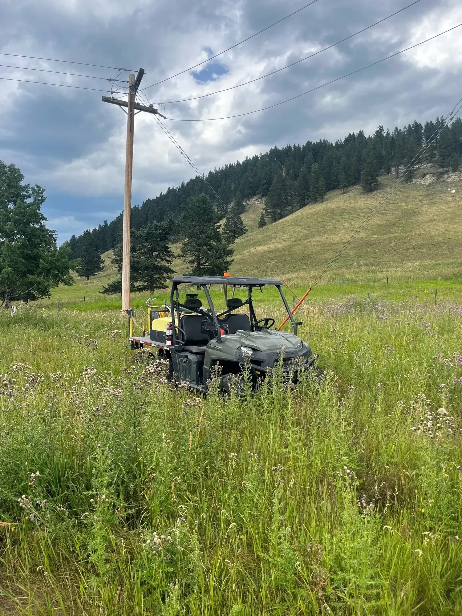 UTV spraying along a pipeline right-of-way